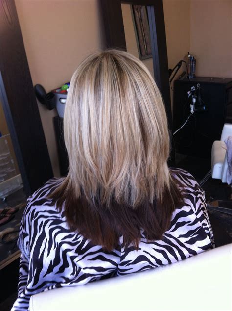 black and blonde hair underneath|blonde on top dark underneath.